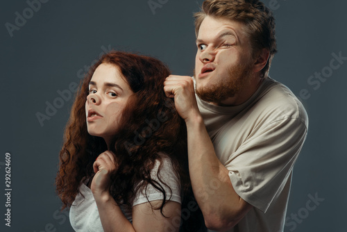 Fotografie Couple faces crushed on glass, funny emotion