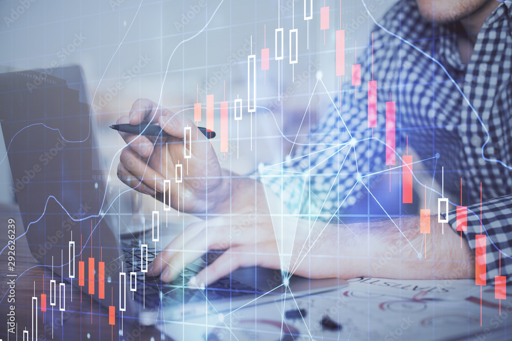 Double exposure of forex graph with man working on computer on background. Concept of market analysis. Double exposure of forex graph with man working on computer on background. Concept of market analysis.
