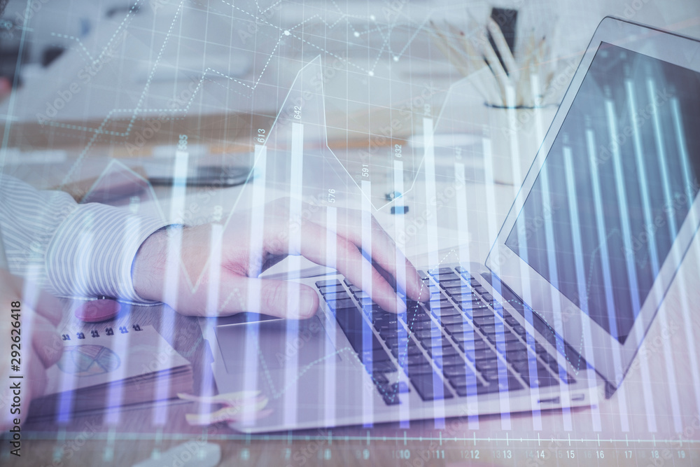 Multi exposure of stock market graph with man working on laptop on background. Concept of financial analysis. Multi exposure of stock market graph with man working on laptop on background. Concept of financial analysis.