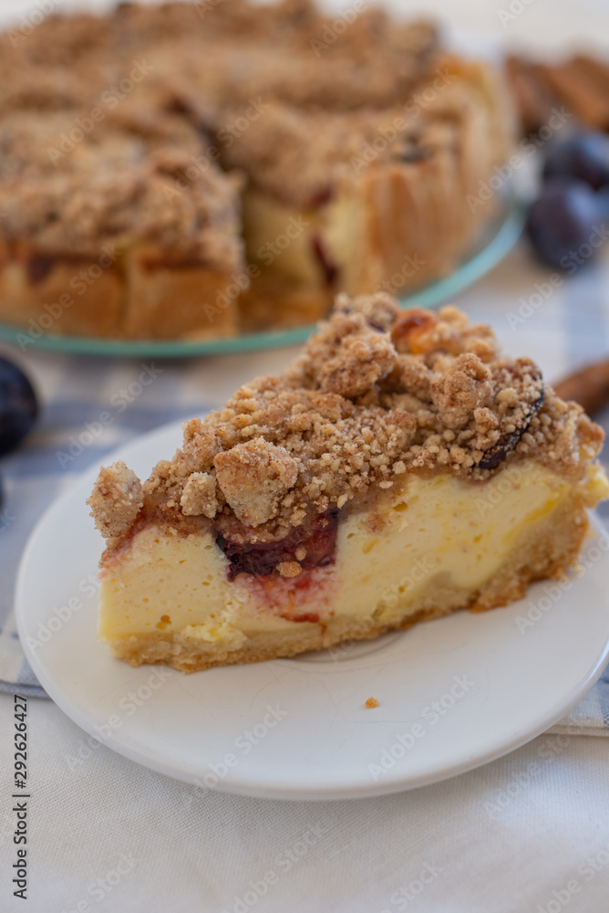 Fresh plum cheesecake with cinnamon and almond crumble Fresh plum cheesecake with cinnamon and almond crumble
