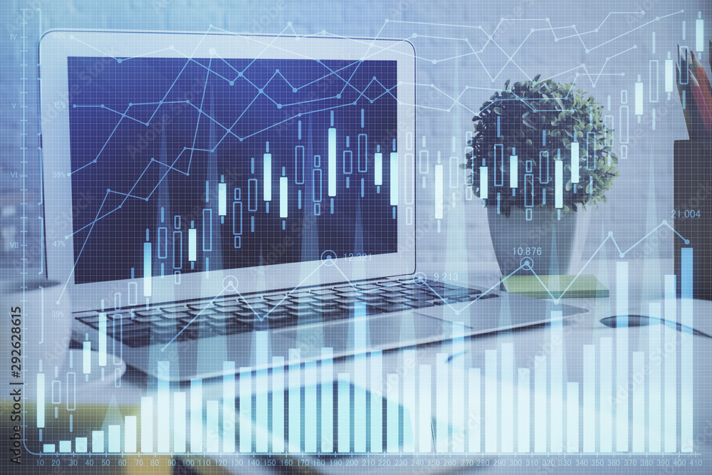 Double exposure of chart and financial info and work space with computer background. Concept of international online trading. Double exposure of chart and financial info and work space with computer background. Concept of international online trading.