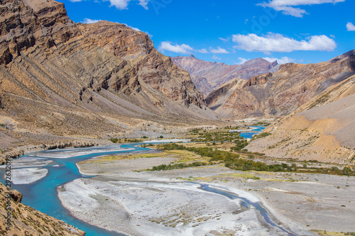 Himalayan mountain landscape along Leh to Manali highway. Blue river and rocky mountains in Indian Himalayas, India