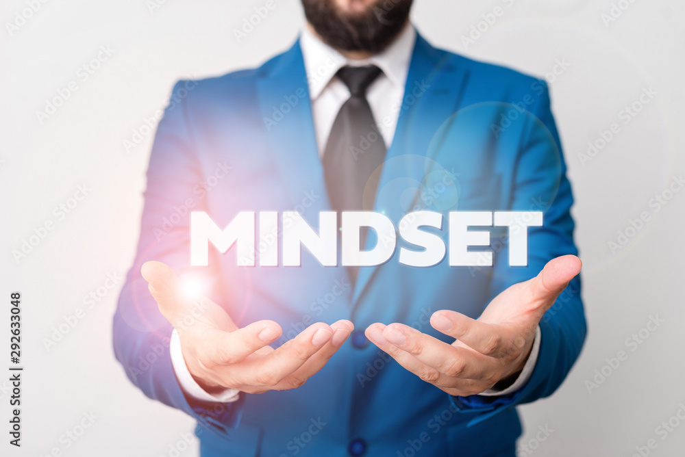 Text sign showing Mindset. Business photo showcasing A standard thought of a demonstrating of what he orshe will be done Man with opened hands in fron of the table. Mobile phone and notes on the table - obrazy, fototapety, plakaty 
