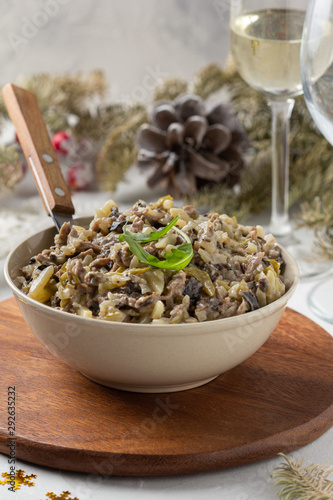 Salad with mushrooms, beef, potatoes and onions for new year, Christmas. Winter holiday, celebration, traditional Russian food
