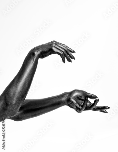 Black painted hands with long nails isolated on white background
