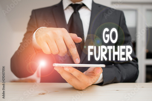 Writing note showing Go Further. Business concept for To move to a greater distance or overcome your limitations