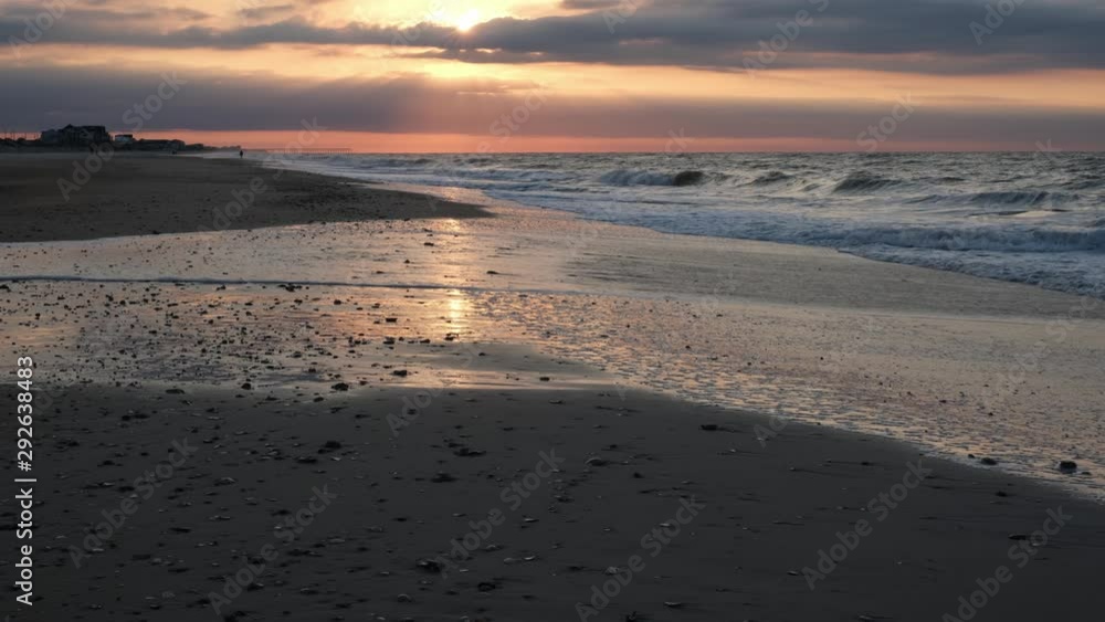 Beautiful sunrise, waves, and ocean scenery at Topsail Beach, a vacation community by the Atlantic ocean in North Carolina, USA Beautiful sunrise, waves, and ocean scenery at Topsail Beach, a vacation community by the Atlantic ocean in North Carolina, USA