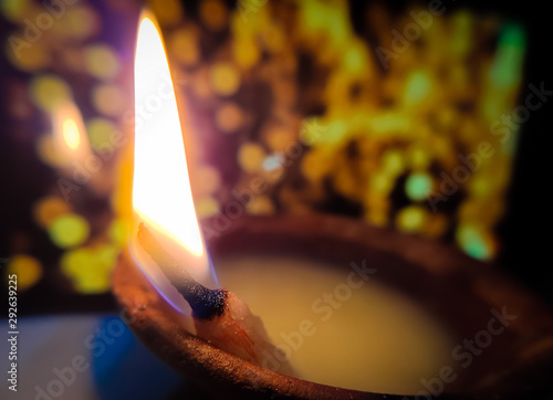 Stock photo of beautiful diwali diya with bokeh lights background photo