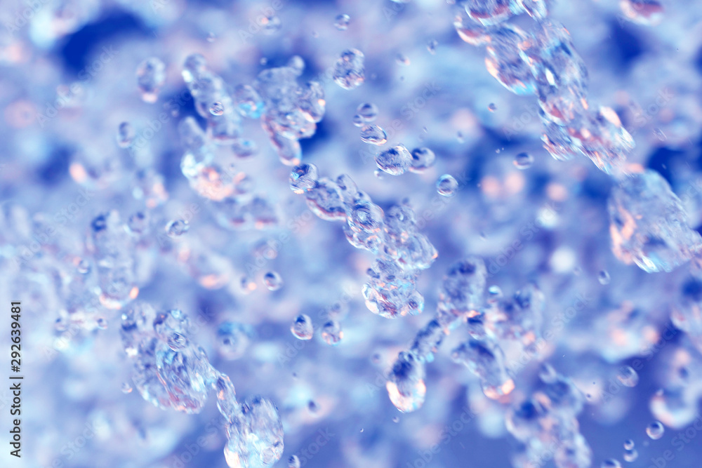 Water splashes, abstract surface, close-up. Blue and pink background Water splashes, abstract surface, close-up. Blue and pink background