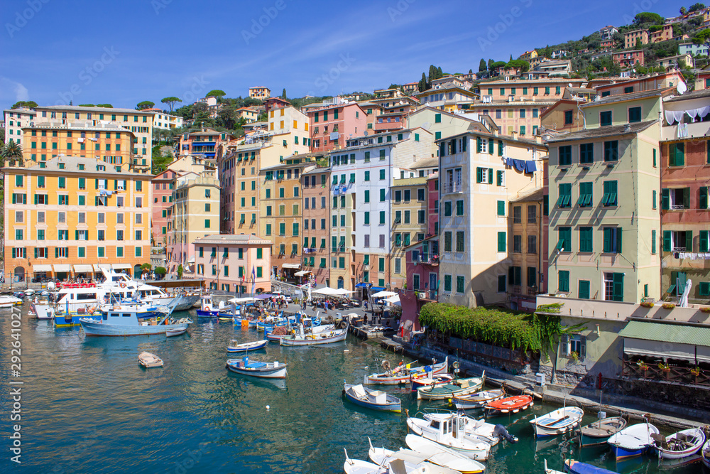 Colorful buildings and beach at Camogli on sunny summer day, Liguria