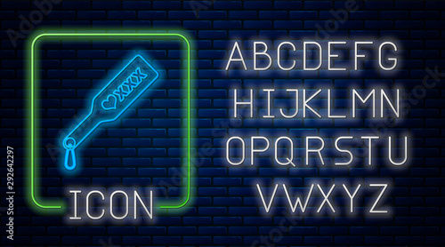 Glowing neon Spanking paddle icon isolated on brick wall background. Fetish accessory. Sex toy for adult. Neon light alphabet. Vector Illustration