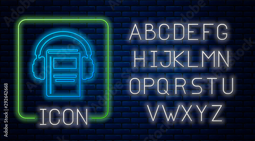 Glowing neon Audio book icon isolated on brick wall background. Book with headphones. Audio guide sign. Online learning concept. Neon light alphabet. Vector Illustration