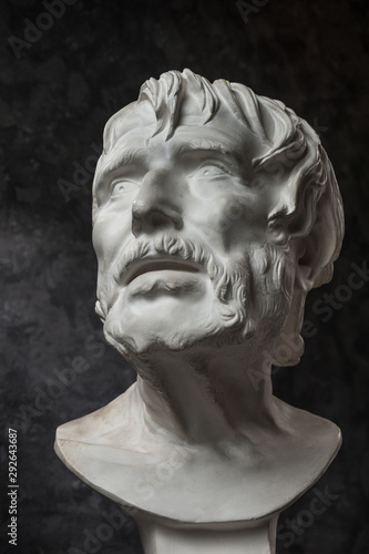 Принти на полотні Gypsum copy of ancient statue Seneca head on dark textured background