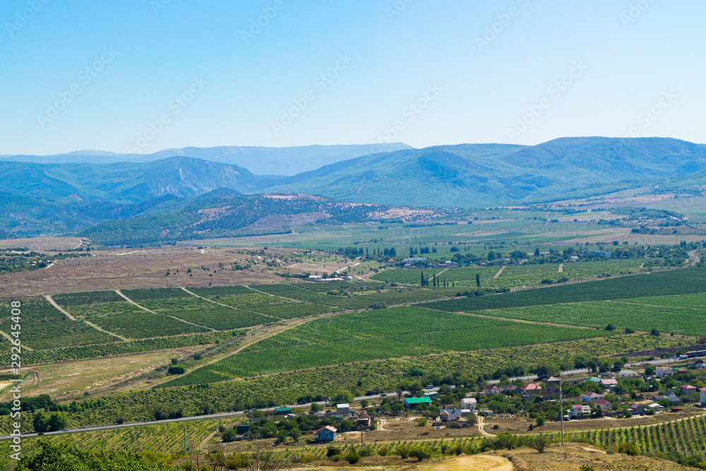 Crimean landscape in the foreground cultivated fields and behind the low mountains.