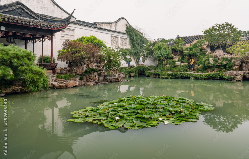 Pond and pavilion in Master of the Nets Garden or Wangshi Garden in Suzhou, China, among the finest gardens in China and UNESCO World Heritage Site.