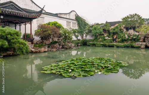 Pond and pavilion in Master of the Nets Garden or Wangshi Garden in Suzhou, China, among the finest gardens in China and UNESCO World Heritage Site. photo