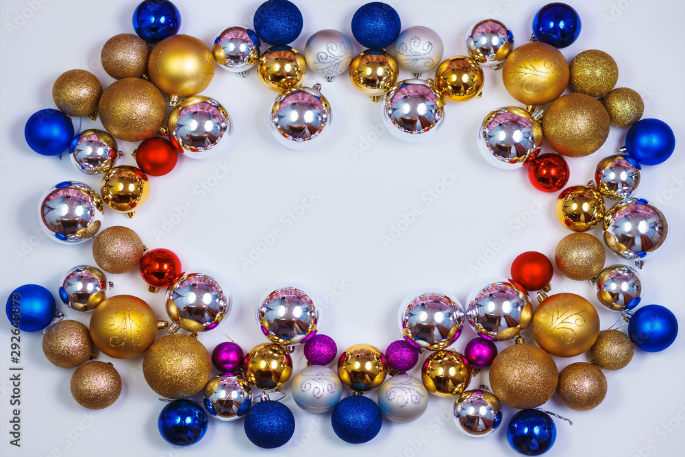 Glitter Christmas balls pattern. Flat lay, top view, copy space. Christmas golden,red,violet, blue and silver balls decorations on white background. New year creative arrangement frame. Glitter Christmas balls pattern. Flat lay, top view, copy space. Christmas golden,red,violet, blue and silver balls decorations on white background. New year creative arrangement frame.