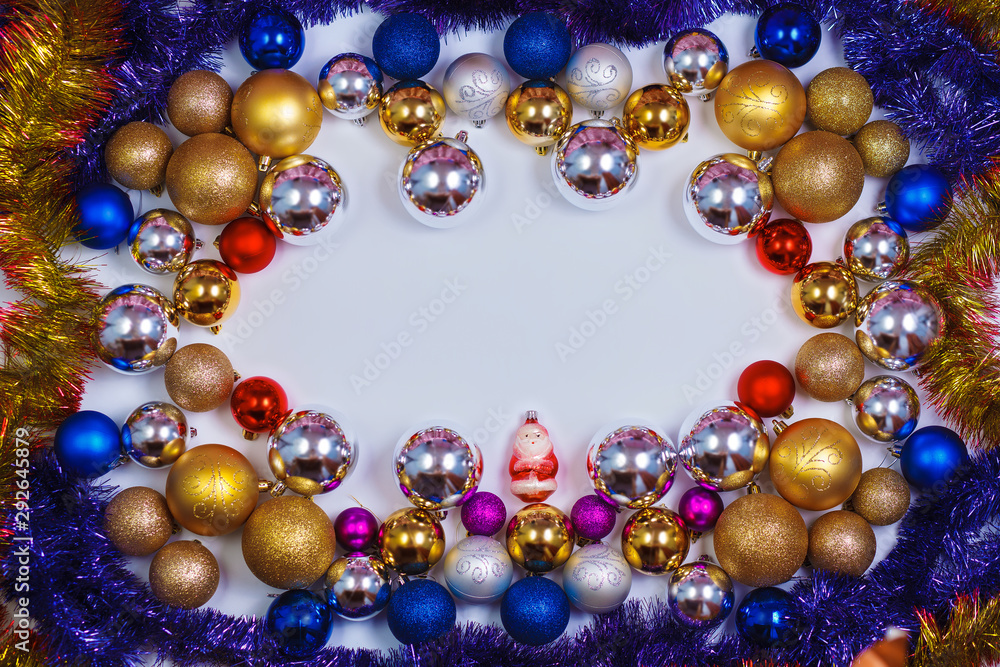 Glitter Christmas balls pattern. Flat lay, top view, copy space. Christmas golden,red,violet, blue and silver balls decorations on white background. New year creative arrangement frame. Glitter Christmas balls pattern. Flat lay, top view, copy space. Christmas golden,red,violet, blue and silver balls decorations on white background. New year creative arrangement frame.