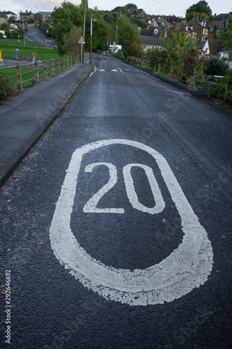 Drivers warned by a bold painted 20MPH sign in the road and speed bumps that they are approaching a playground