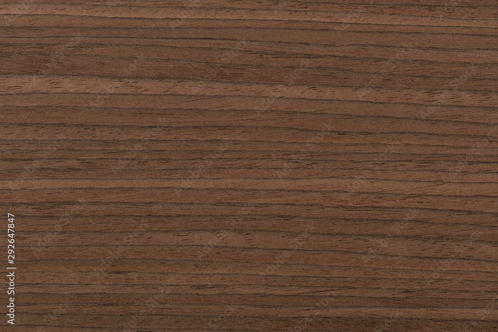 Natural dark brown nut veneer background as part of your design. High quality texture in extremely high resolution. Natural dark brown nut veneer background as part of your design. High quality texture in extremely high resolution.