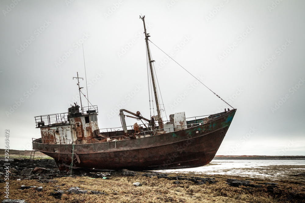 Abandoned ship on the coast of the Arctic Ocean. Abandoned ship on the coast of the Arctic Ocean.