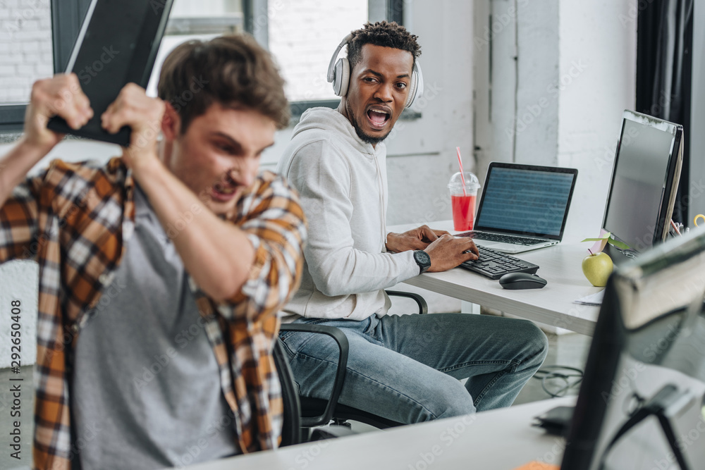 selective focus of african american programming yelling at angry colleague selective focus of african american programming yelling at angry colleague