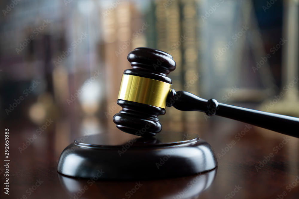 Lawyer concept. Gavel on the bookshelf background. Lawyer concept. Gavel on the bookshelf background.