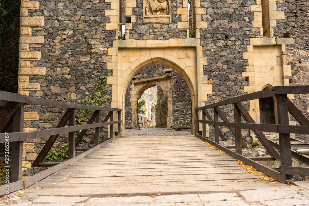 Medieval castle gate with bridge and stone portal (Grodziec Castle, Poland)