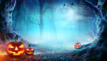 Jack O’ Lanterns In Spooky Forest At Moonlight - Halloween