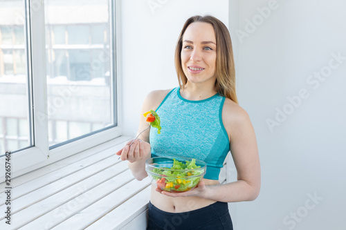 Εκτύπωση καμβά Healthy lifestyle, fitness and diet concept - dietary salad and slim woman in sp