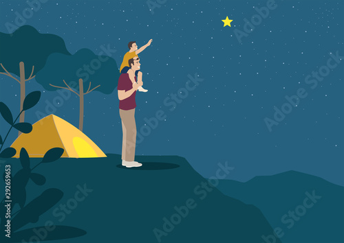 Father carrying his son on shoulder to grab star