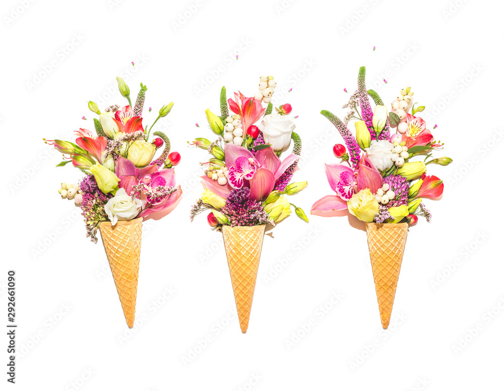 Fototapeta Three waffle cones with flowers on white background
