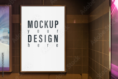 Mock up of light box in a city on the wall for your advertising. Blank mock up of vertical street poster billboard for your text message or promotional content. street advertising billboard mockup. photo