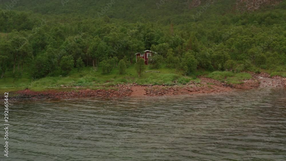 Fishermen on an inflatable boat in the fjord Fishermen on an inflatable boat in the fjord