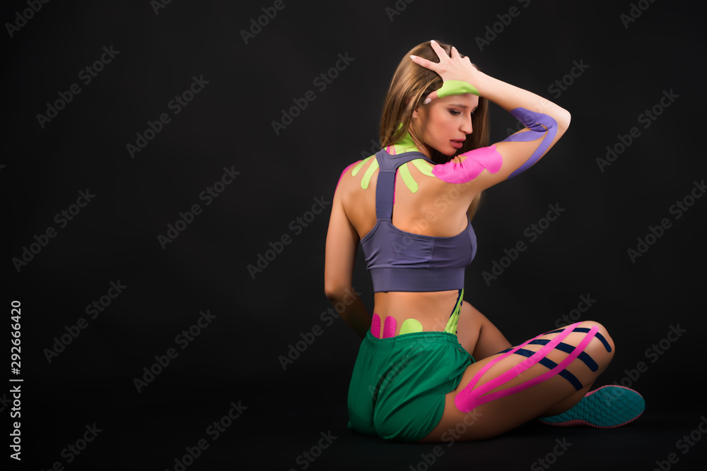 Fototapeta premium Portrait of a motivated woman, alternative kinesio therapy