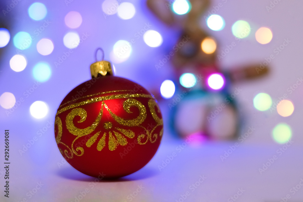 Fototapeta premium Red Christmas toy and lights. Christmas mood. New Year's Holidays.