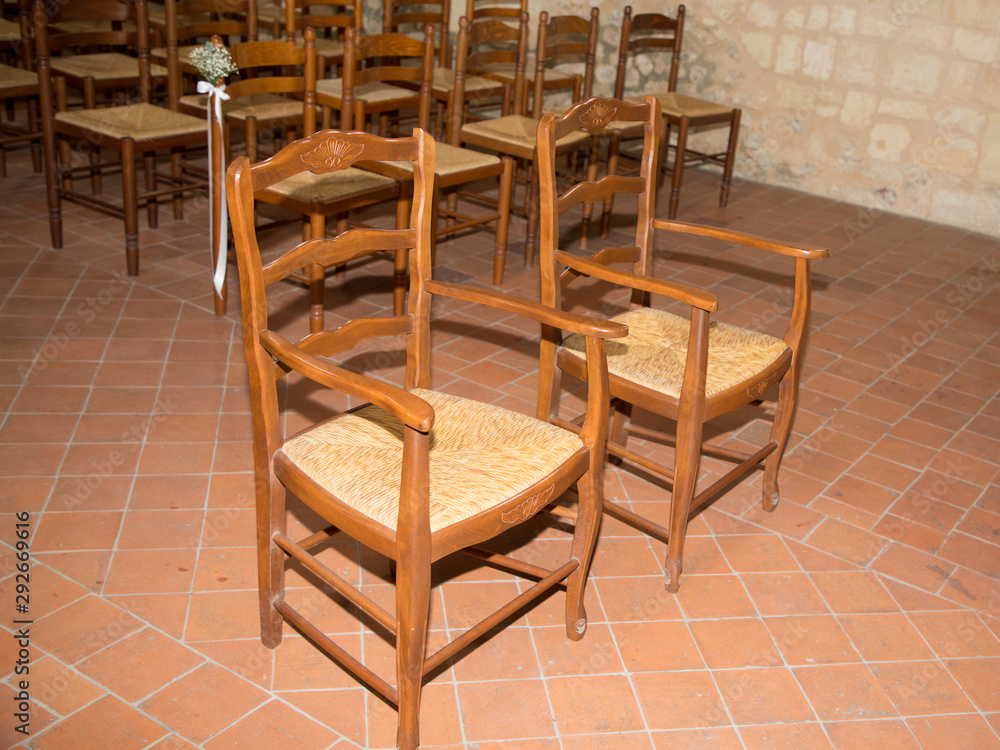 Empty bride groom chairs in church for weeding