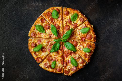 pizza with salami, sausage and cheese (delicious snack) menu concept. food background. copy space. Top viev