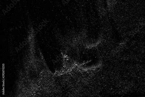 abstract real dust floating over black background for overlay