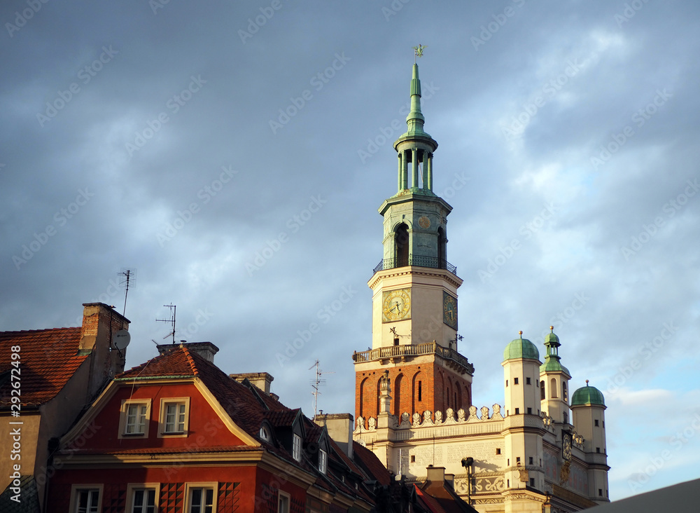 Tower of the historical town hall in Poznan. Sun and clouds. Renaissance architecture in Poland