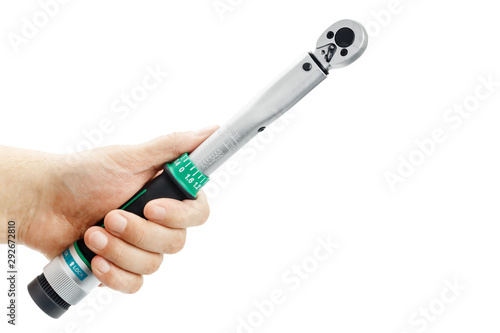Torque wrench in hand isolated on a white background photo