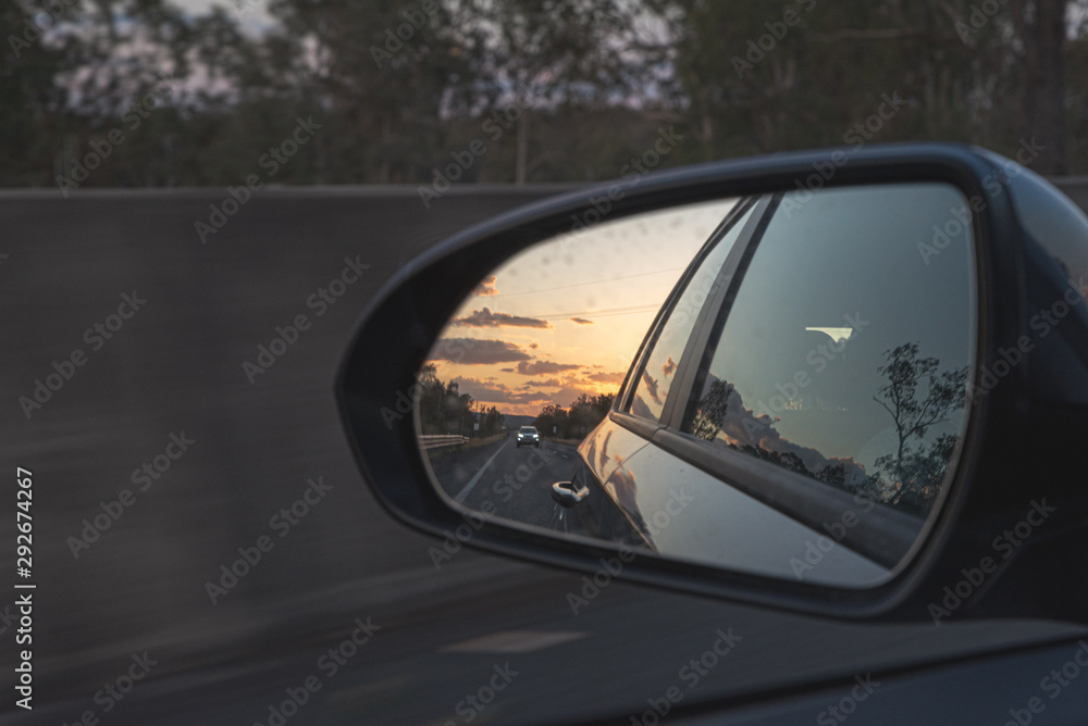 looking through a side mirrors with a car in it in australia