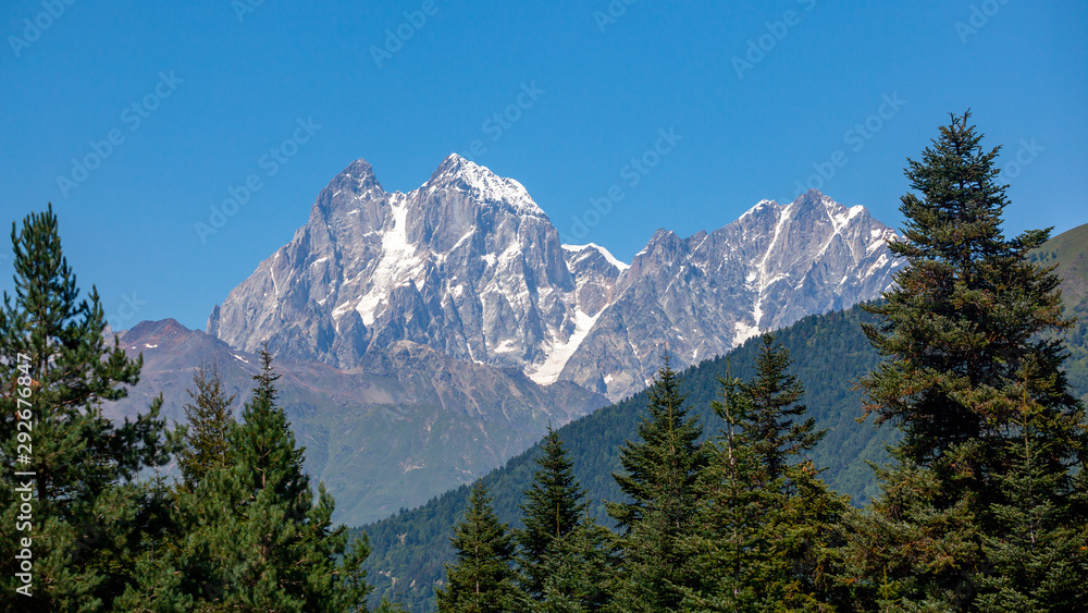 View of Mount Ushba. Ushba is one of the most notable peaks of the Caucasus range, located in the Svaneti region of Georgia. View of Mount Ushba. Ushba is one of the most notable peaks of the Caucasus range, located in the Svaneti region of Georgia.