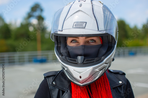 Portrait of a blue-eyed girl in a white helmet. © Anton