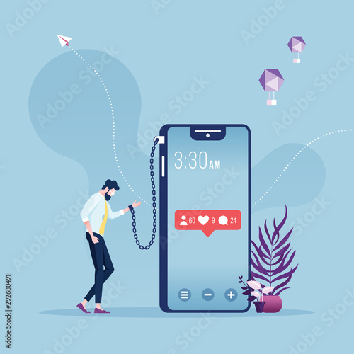 Businessman chained and shackled to a big smart phone-social networks addiction metaphor