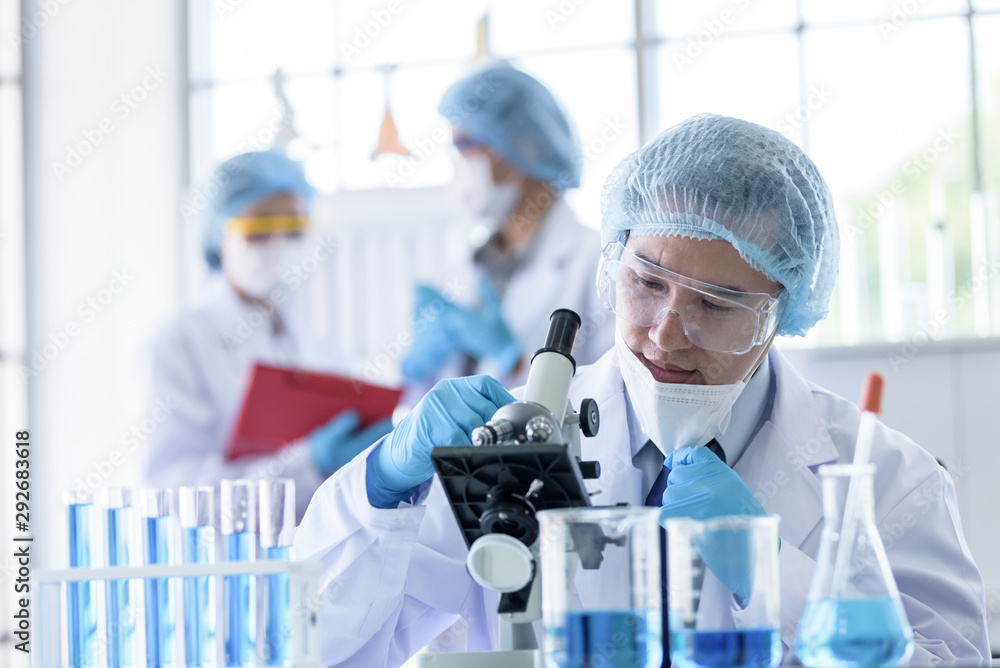 Asian scientist team has researching in laboratory. Asian scientist team has researching in laboratory.