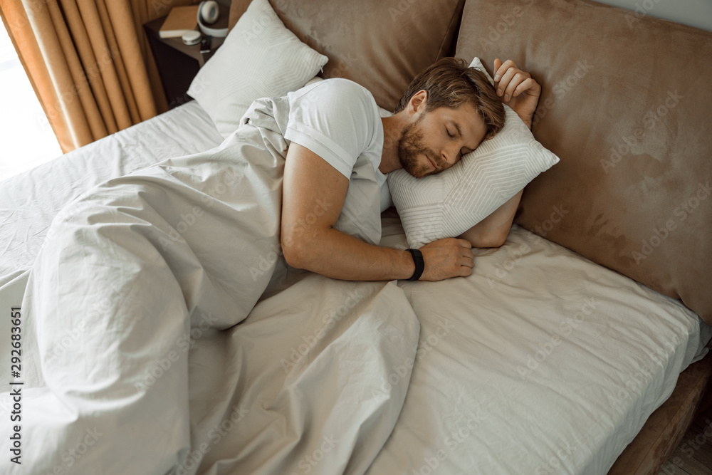 Calm man taking a nap in his bad Calm man taking a nap in his bad