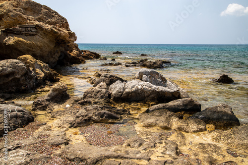 Rocky coastline at the beach of Kiotari on Rhodes island, Greece in summer at a sunny day