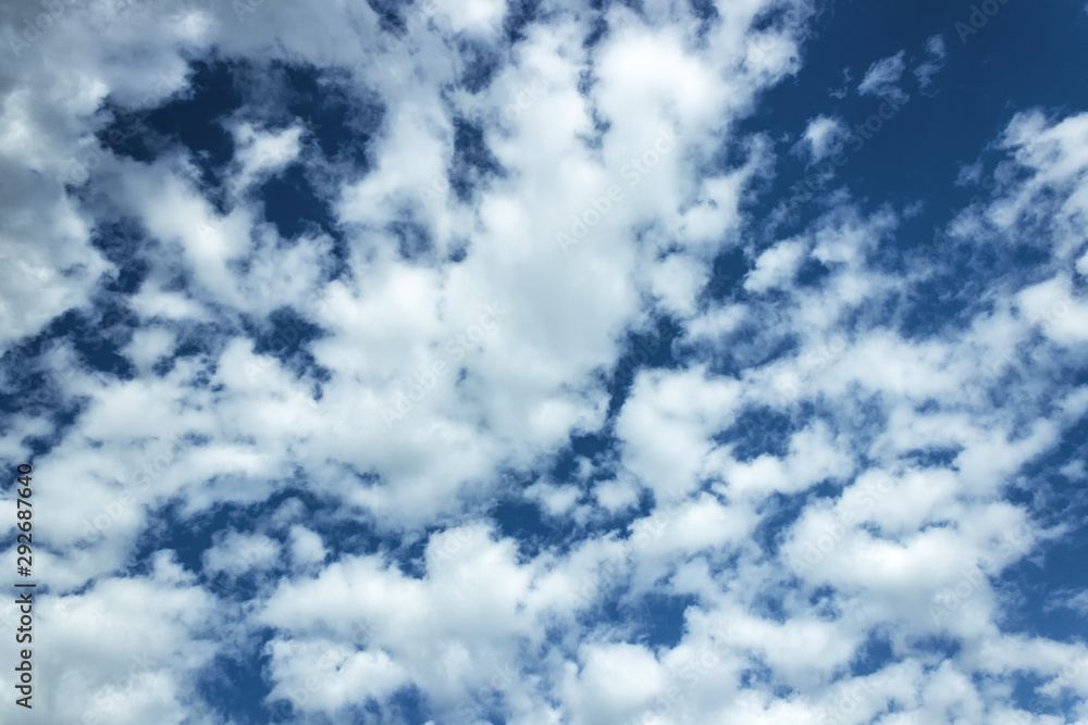 in the blue sky clouds and the sun. in the blue sky clouds and the sun.