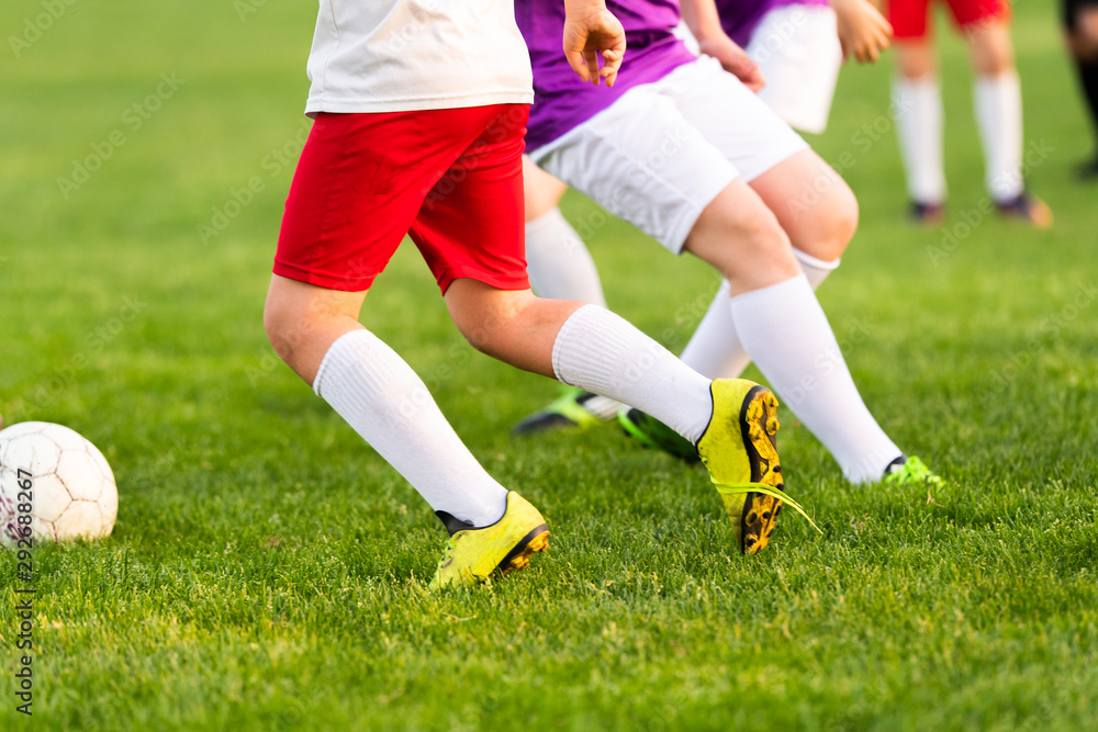 Obraz premium Young boys playing soccer.